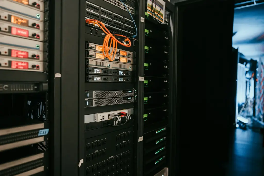 Rows of network and server equipment mounted in a data center rack